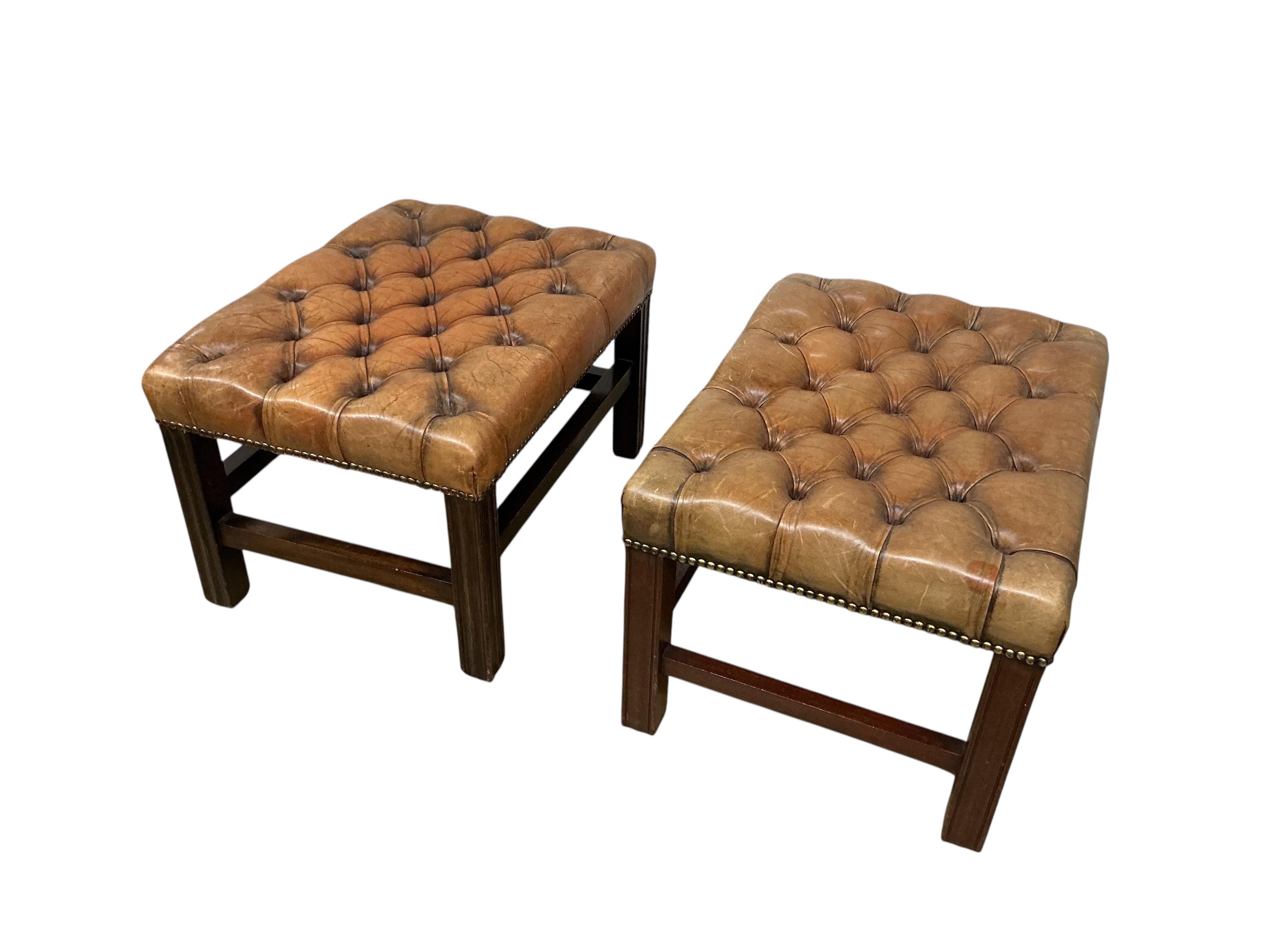 A pair of George III style buttoned brown leather rectangular mahogany stools, width 58cm, depth 44cm, height 36cm